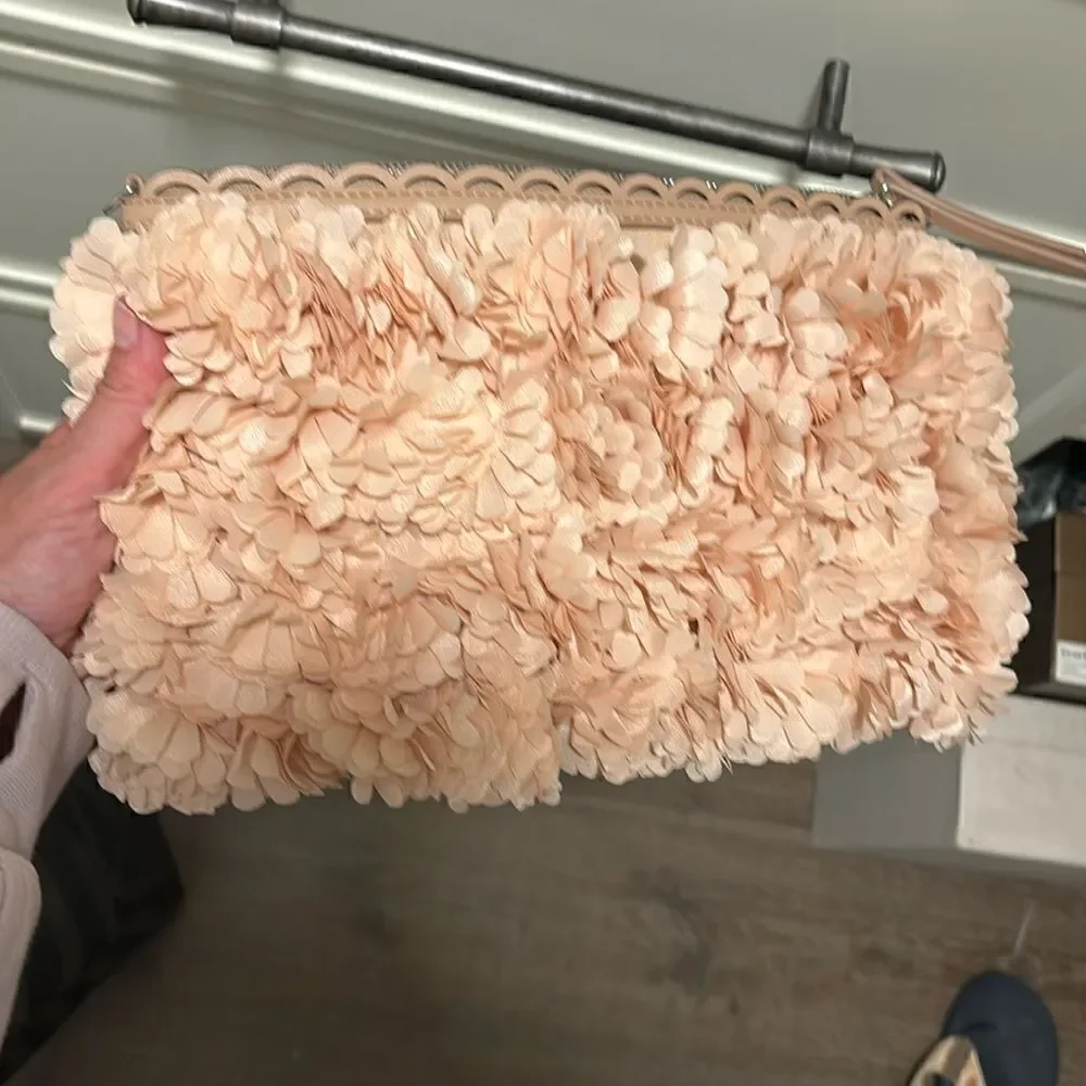 Stella and Dot floral clutch with 3D pastel pink floral, and floral interior